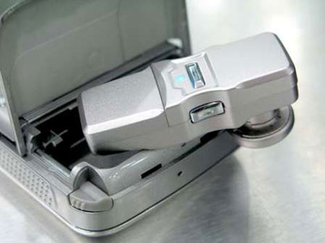 A mobile phone with a hidden Bluetooth headset