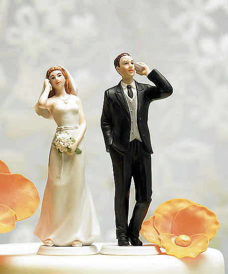 Wedding cake toppers show cellphone-addicted figurines
