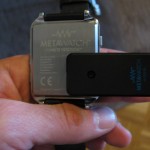 MetaWatch Frame connected to charging clip - back