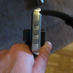 MetaWatch Frame connected to charging clip - side